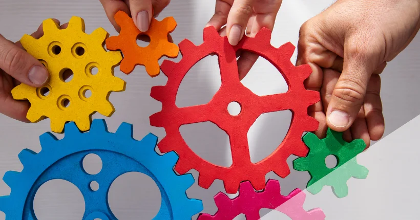 Cross-functional team mapping communication flows and system connections on whiteboard during planning session